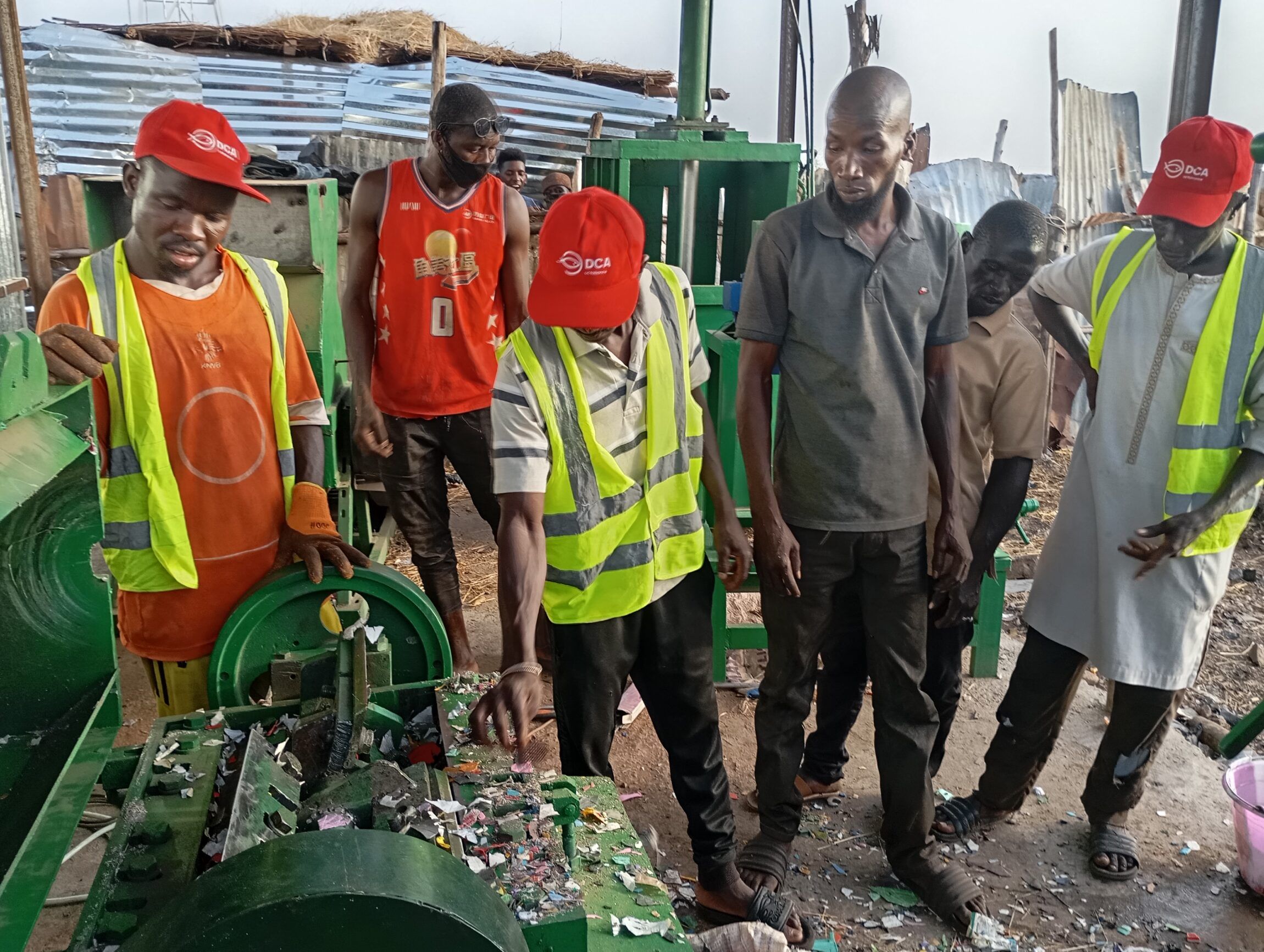 Waste pickers learn how to use a crusher